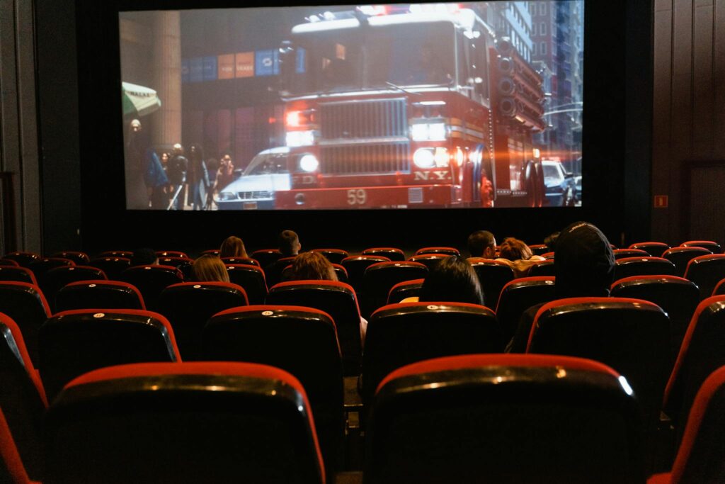 Crafting the Perfect Blog Structure: A Guide for Effective Blogging People seated in a cinema watching a movie on a large screen.